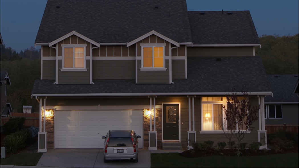 A dark house with lights on